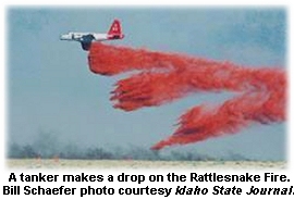 Tanker drops a load on the Rattlesnake Fire