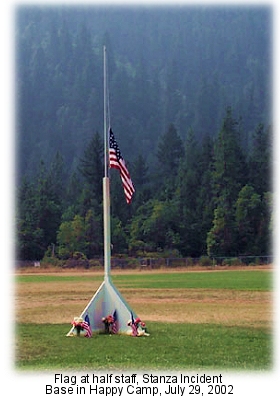 Stanza Fire memorial with flag at half staff