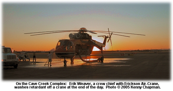 Erik Weaver washes a crane on the Cave Creek Fire